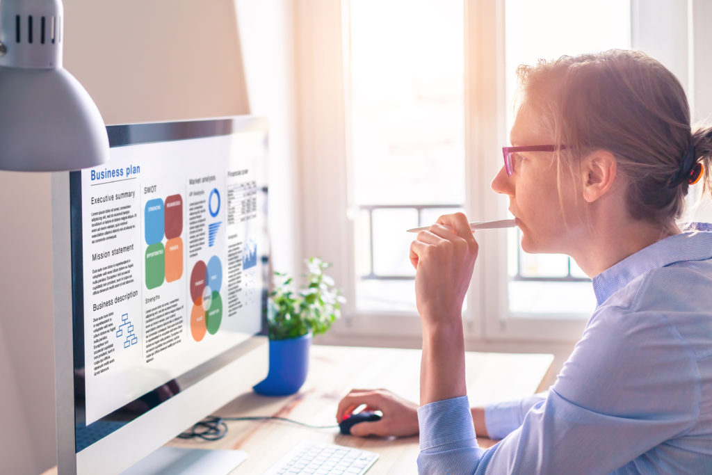 Business woman looking at screen